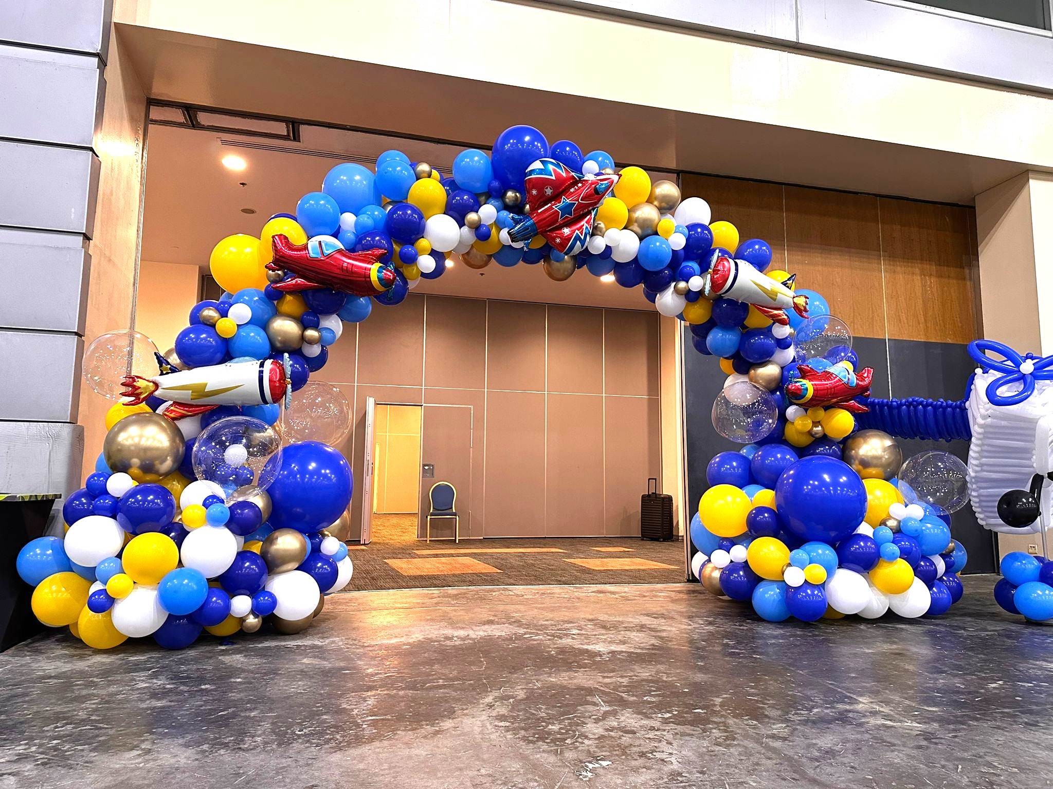 Aviation-themed organic balloon arch entrance event decorations Singapore