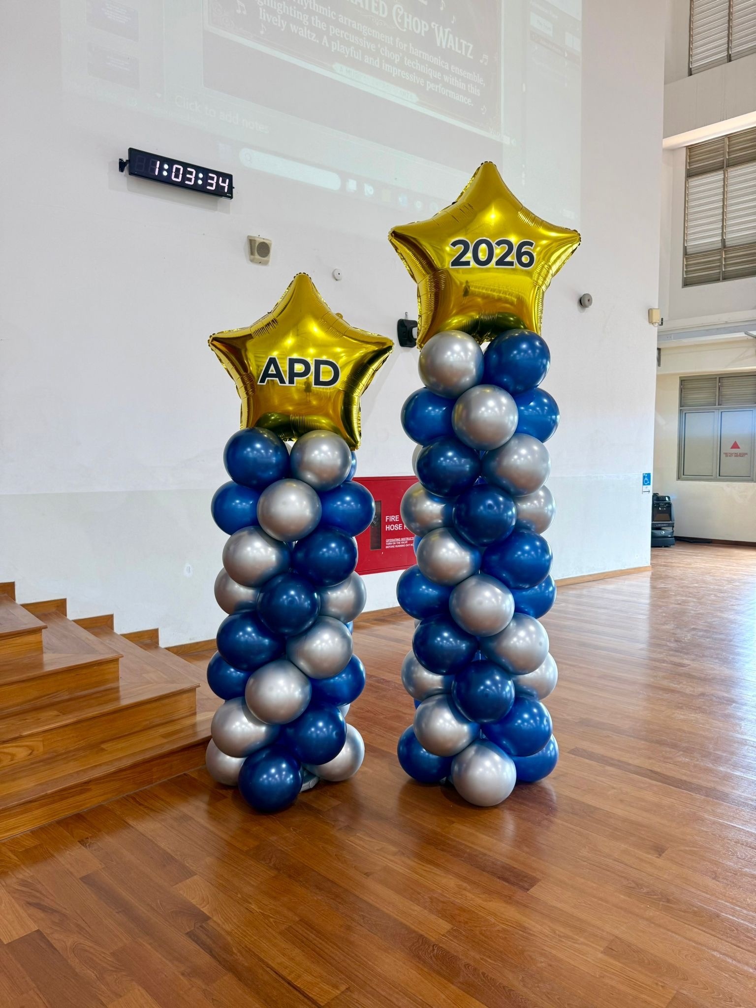 Custom balloon columns with gold star toppers for school event Balloon Decorations Singapore