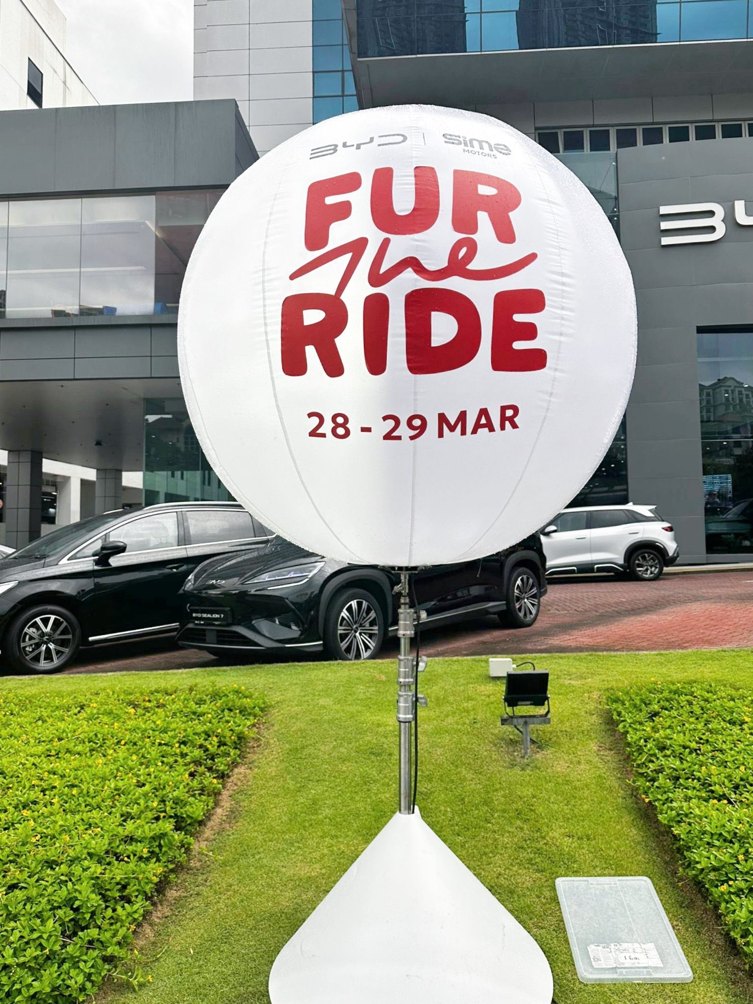Custom branded advertising balloon stand at car showroom event Singapore