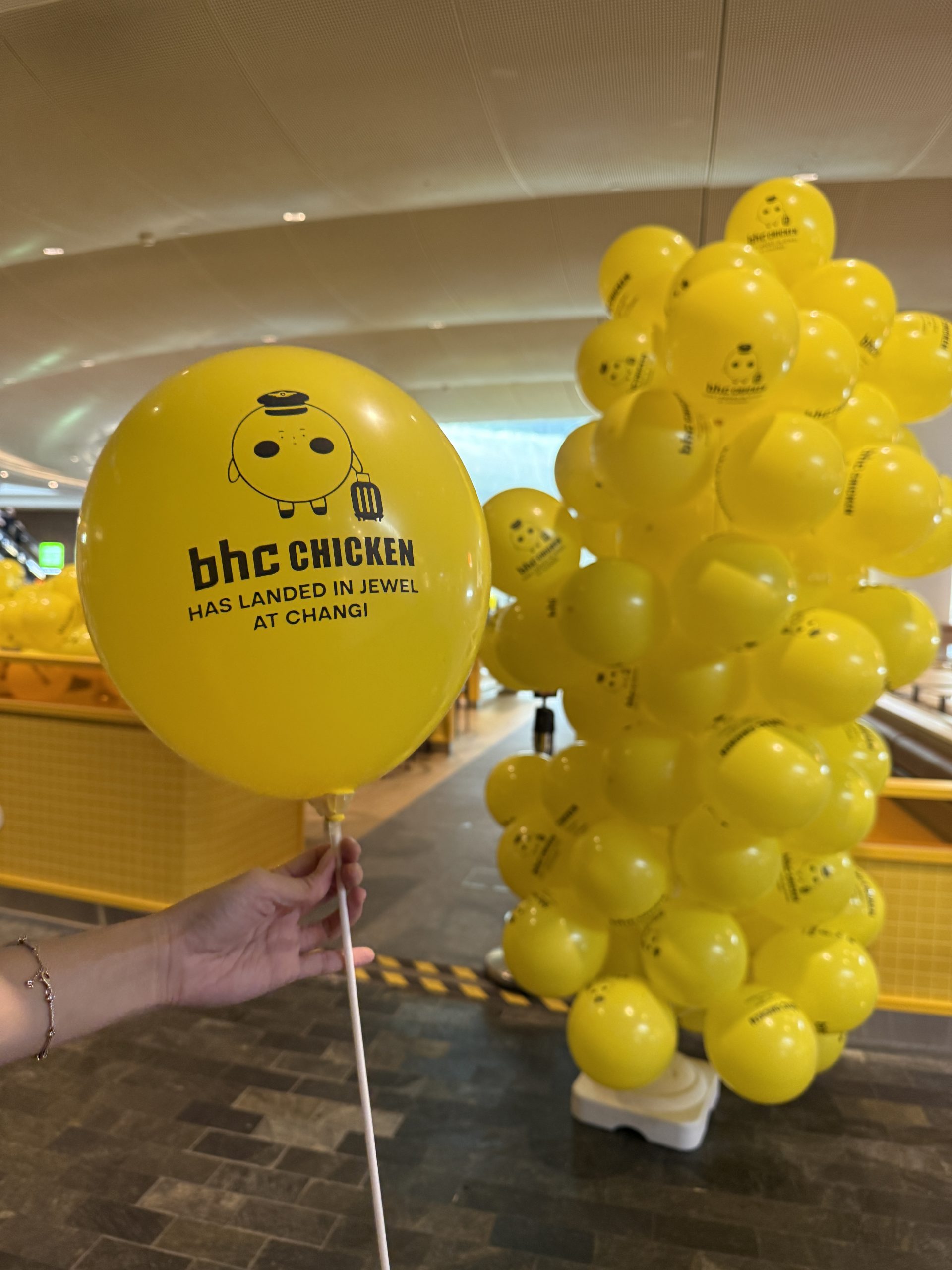 Custom printed BHC Chicken yellow balloons on sticks — event display