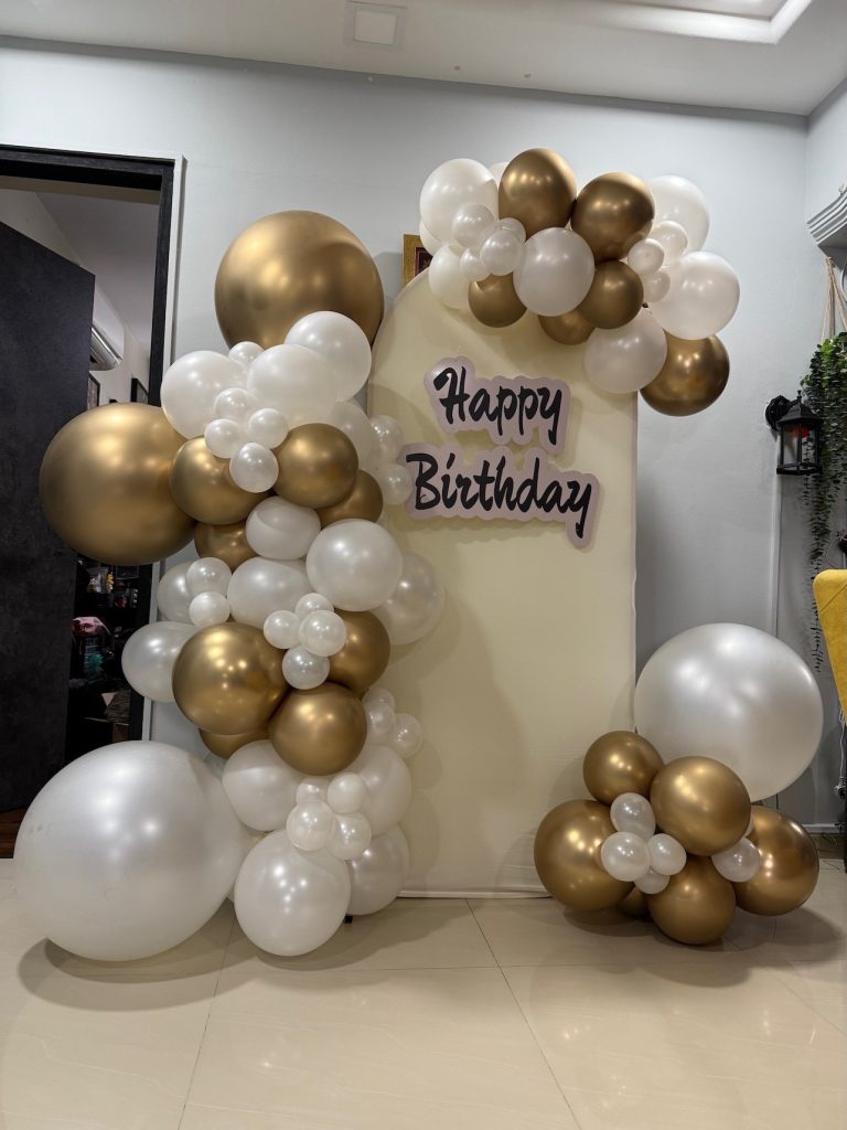 Gold and white organic balloon garland birthday backdrop in Singapore