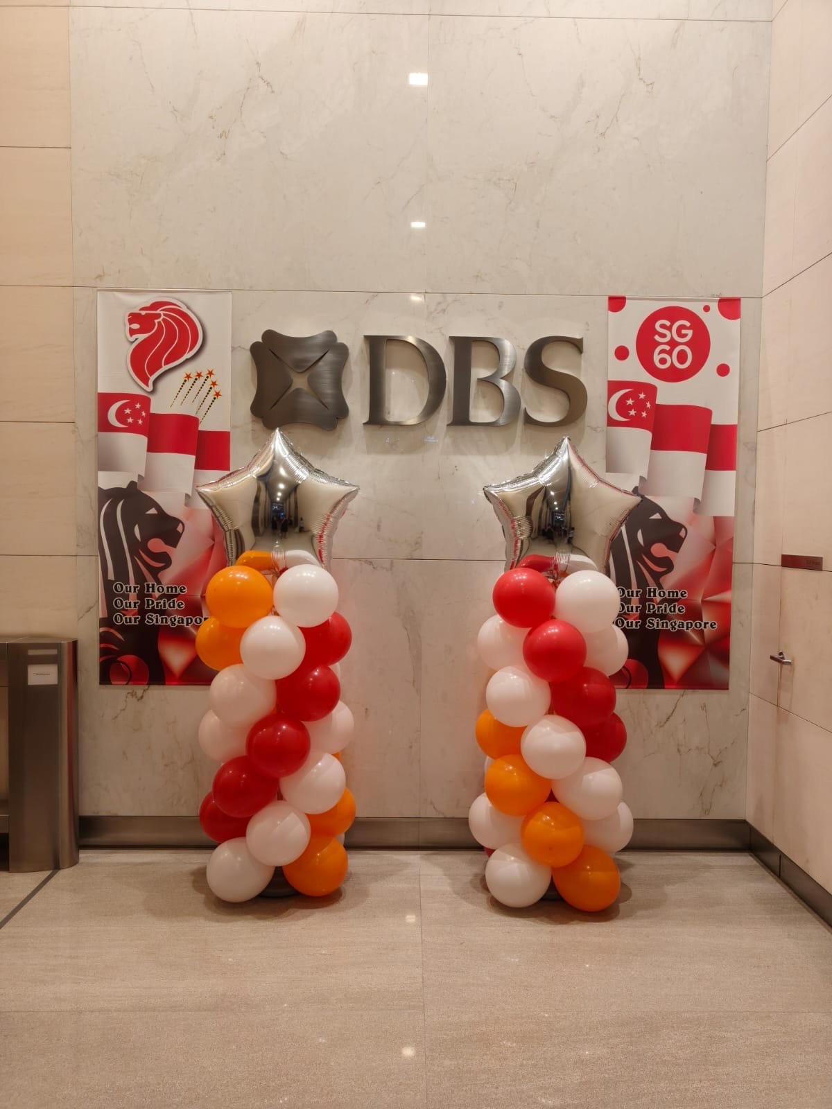 Balloon columns for a corporate National Day display at DBS lobby event decorations Singapore