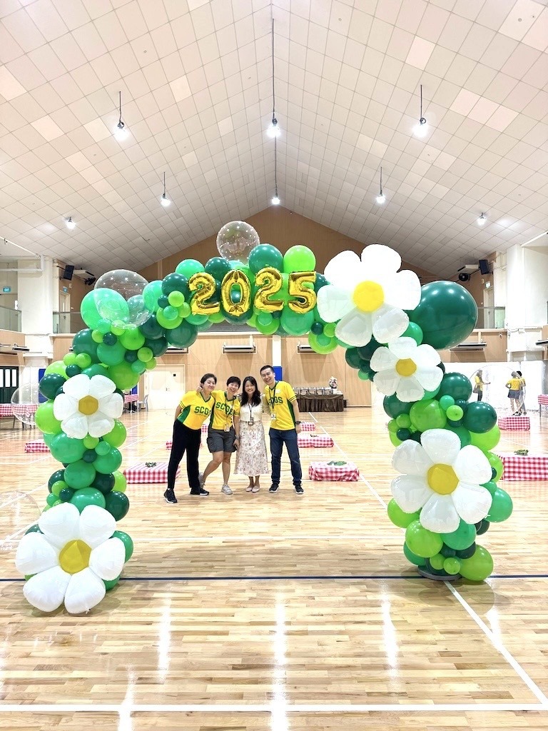 Green floral organic balloon arch for a school event balloon decorations Singapore