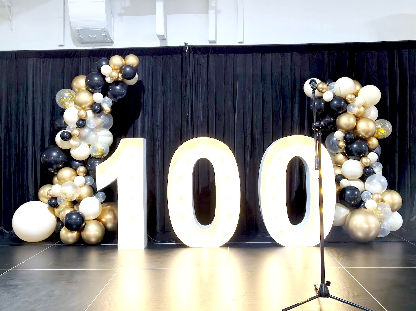 Marquee light-up numbers with organic balloon garland corporate event decorations Singapore