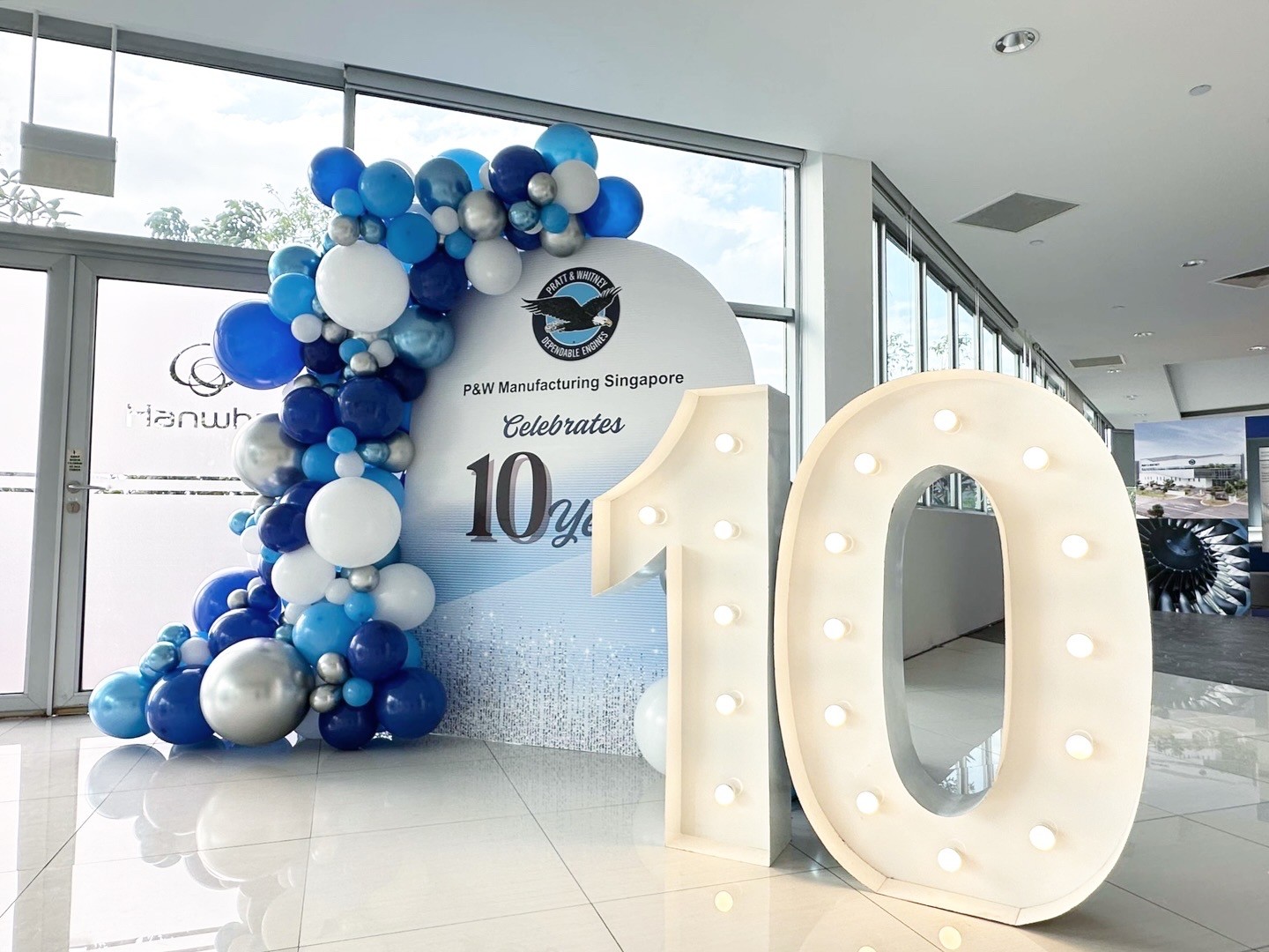 Organic balloon garland arch for a corporate anniversary event balloon decorations Singapore
