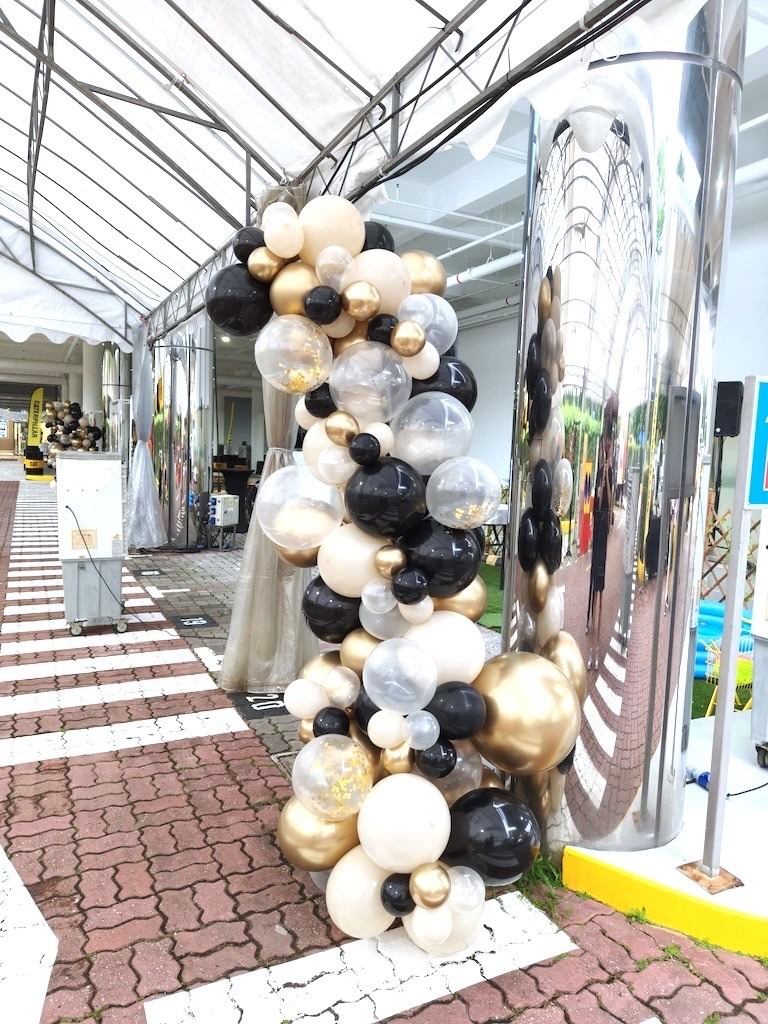 Organic black and gold balloon garland for a corporate event decorations Singapore