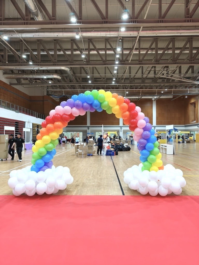 Rainbow balloon arch with white cloud base event balloon decorations Singapore