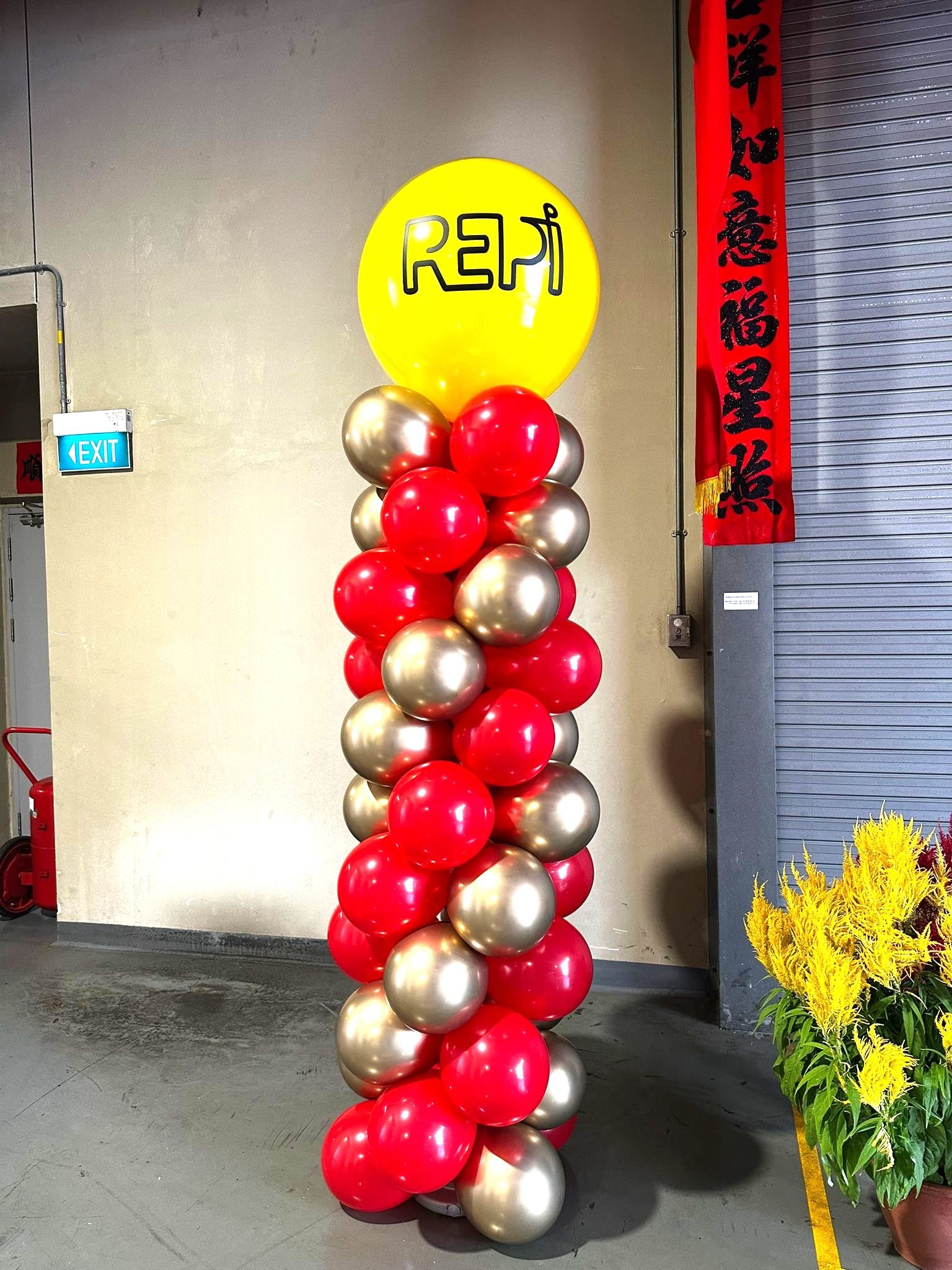 Red and gold balloon column for branded corporate event in Singapore