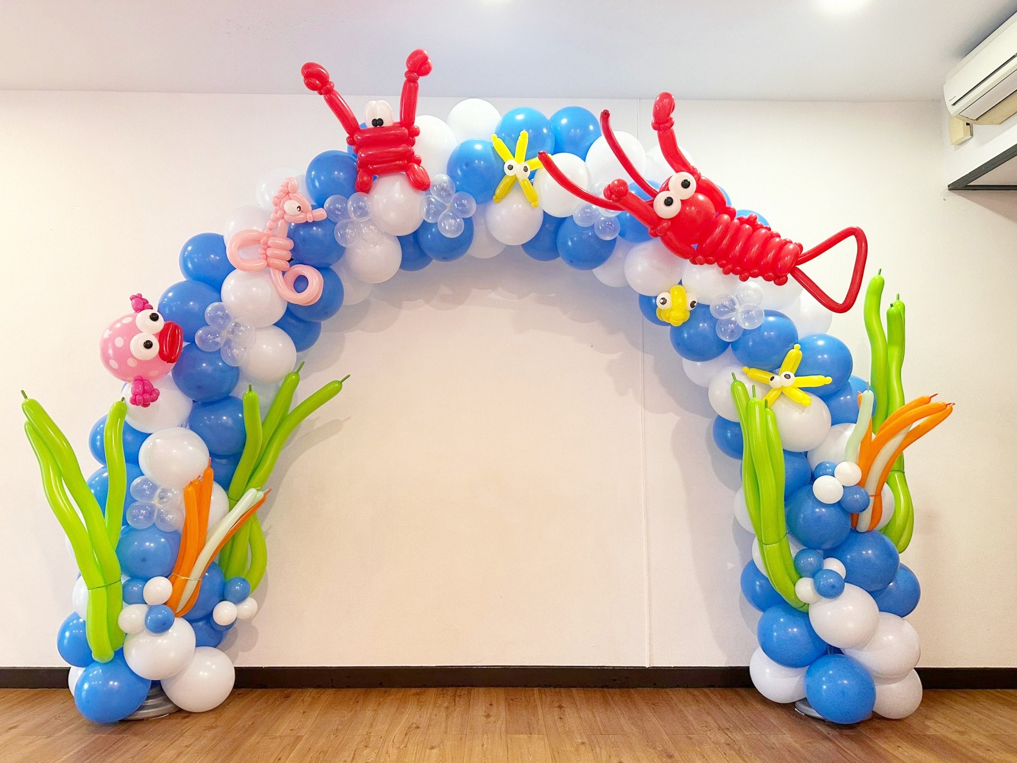 Underwater-themed balloon arch backdrop for a kids party balloon decorations Singapore