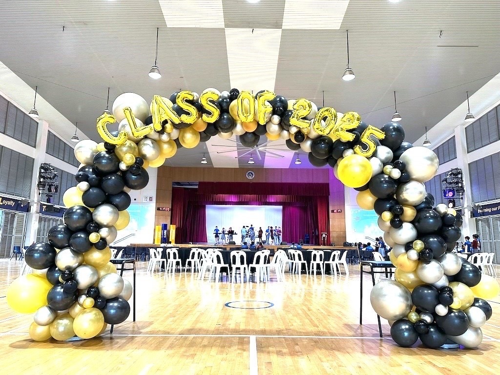 Class of 2026 graduation balloon arch in school hall Singapore