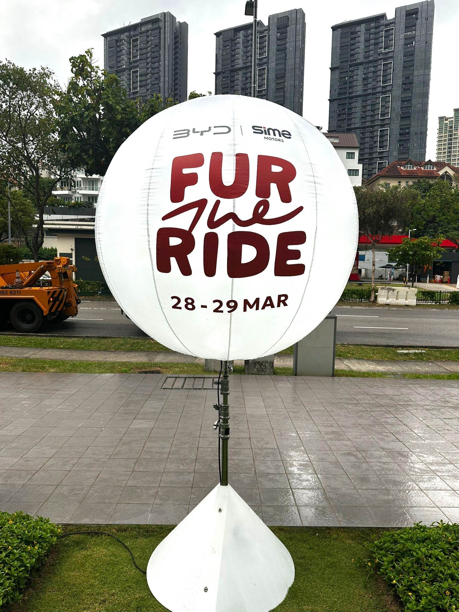 Branded advertising balloon stand at BYD corporate event in Singapore