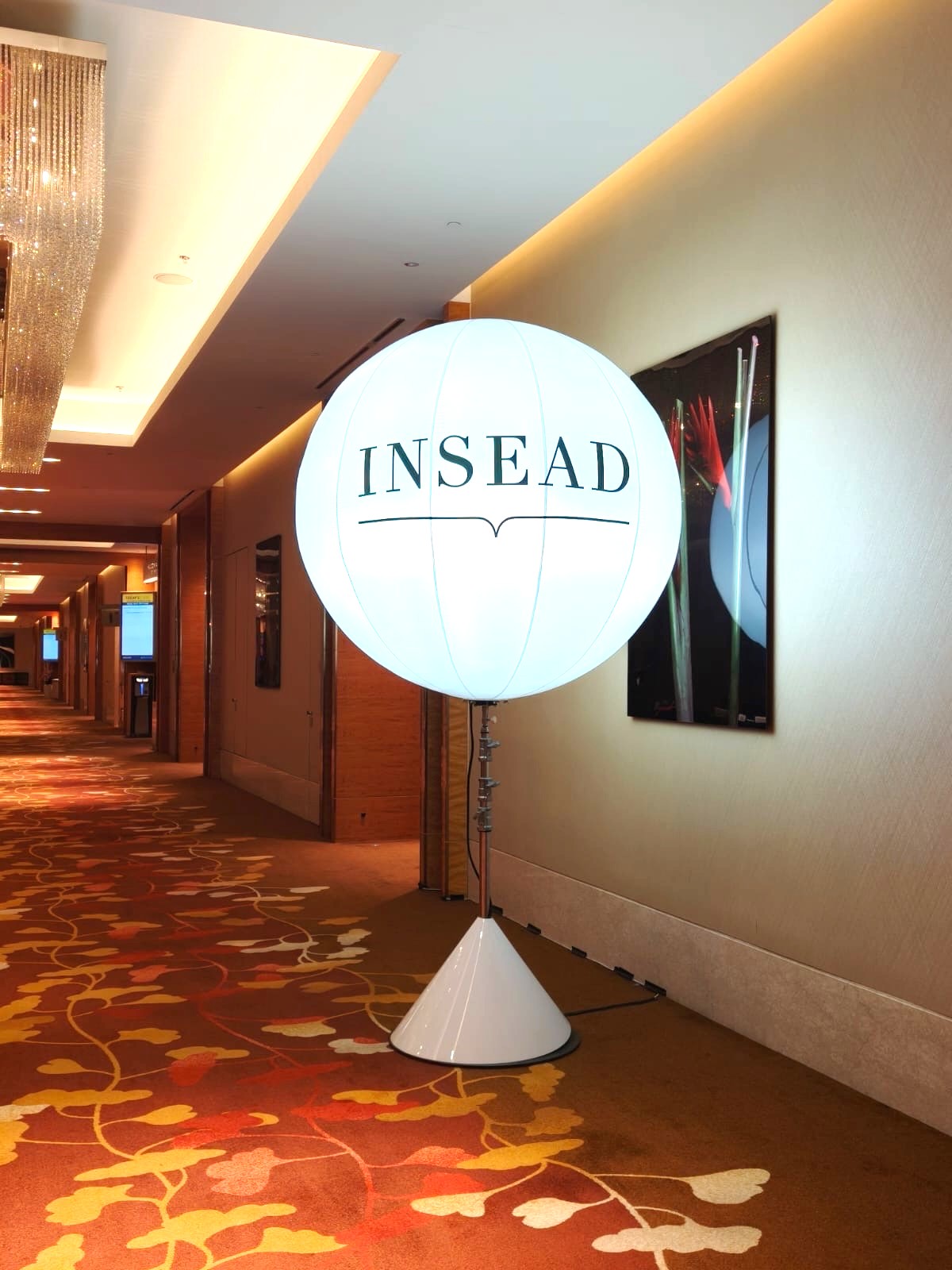 Lighted balloon stand with corporate branding at hotel event in Singapore
