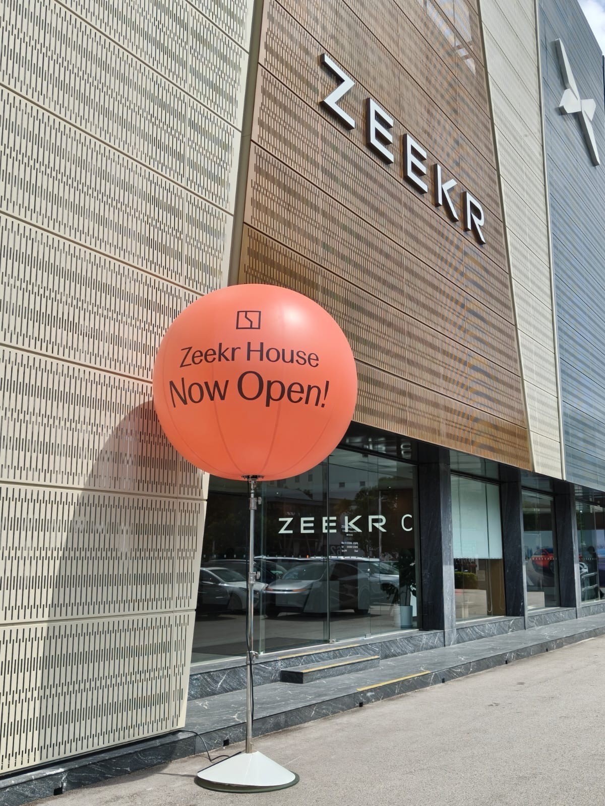 Branded advertising balloon stand at Zeekr showroom opening in Singapore
