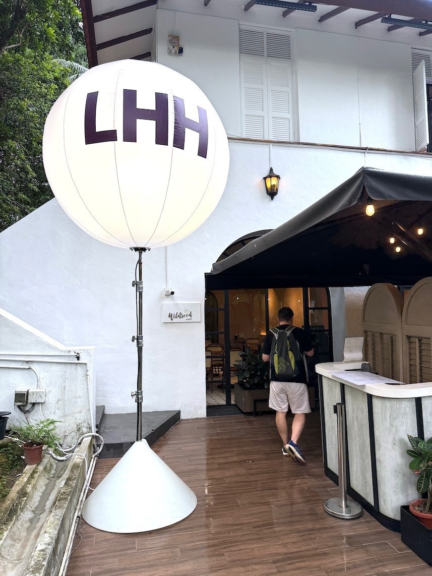 Lighted advertising balloon stand at corporate event venue in Singapore
