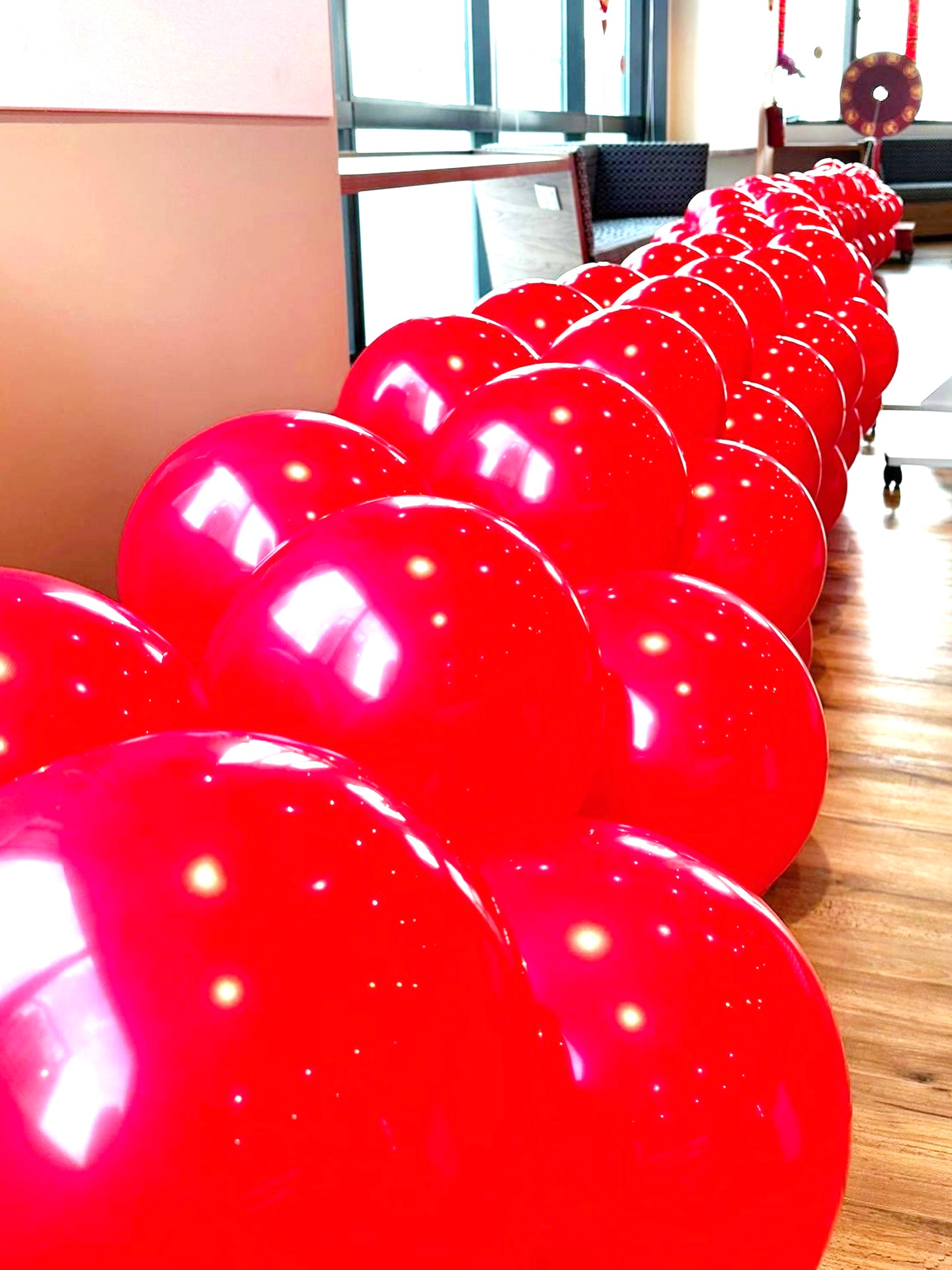 Red balloon garland decoration for a corporate event in Singapore